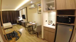 Kuchyň nebo kuchyňský kout v ubytování Wyatt Hotel Jomtien Beach