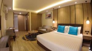 Postel nebo postele na pokoji v ubytování Wyatt Hotel Jomtien Beach