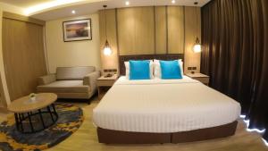 Postel nebo postele na pokoji v ubytování Wyatt Hotel Jomtien Beach