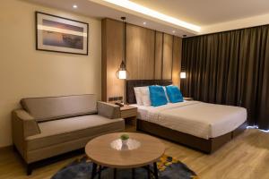 Postel nebo postele na pokoji v ubytování Wyatt Hotel Jomtien Beach
