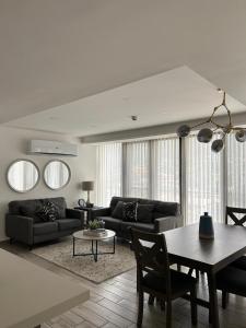 a living room with a couch and a table at Spectacular mountain views at San Pedro Sula in San Pedro Sula