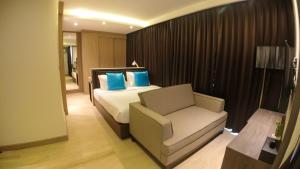 Postel nebo postele na pokoji v ubytování Wyatt Hotel Jomtien Beach