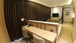 TV a/nebo společenská místnost v ubytování Wyatt Hotel Jomtien Beach