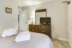 a bedroom with a bed with a dresser and a mirror at Beach and Pool Access Tranquil Hilton Head Getaway in Hilton Head Island +22 photos