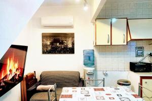 a kitchen with a couch and a fireplace in a room at Welcoming House with Sea View in Corme-Porto in Corme-Puerto