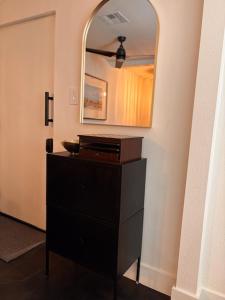 a room with a dresser and a mirror on a wall at My Casitas in Phoenix +26 photos