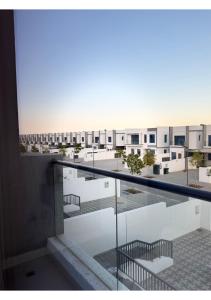 a balcony with a view of a building at 1 - BLUE WORLD - Al Dana Villas in Fujairah +50 photos