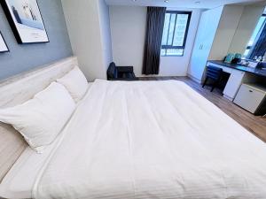 Letto o letti in una camera di Bonjour Hotel