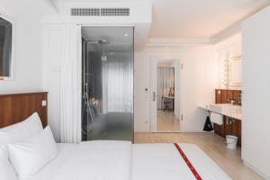 מיטה או מיטות בחדר ב-Ruby Sofie Hotel Vienna