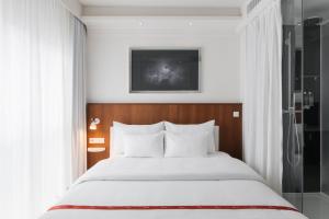 מיטה או מיטות בחדר ב-Ruby Sofie Hotel Vienna