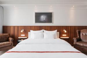 Postel nebo postele na pokoji v ubytování Ruby Sofie Hotel Vienna