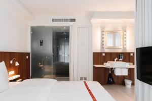 מיטה או מיטות בחדר ב-Ruby Sofie Hotel Vienna