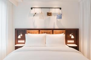 Postel nebo postele na pokoji v ubytování Ruby Stella Hotel London