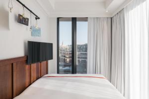 Postel nebo postele na pokoji v ubytování Ruby Stella Hotel London