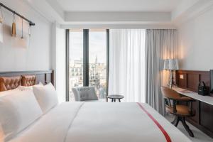 Postel nebo postele na pokoji v ubytování Ruby Stella Hotel London