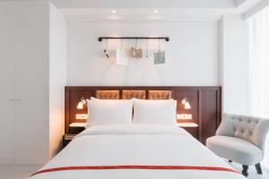 Postel nebo postele na pokoji v ubytování Ruby Stella Hotel London