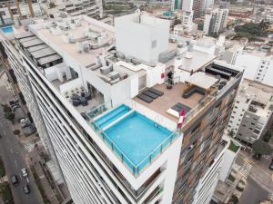 an overhead view of a building with a swimming pool at Inca inn apartments in Lima