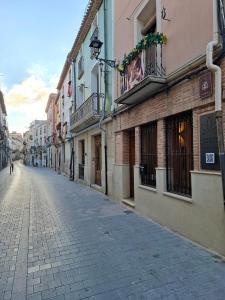 an empty street in a city with buildings at Casa Rural Castalla - Montaña a un paso de la Playa in Castalla