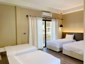 Voodi või voodid majutusasutuse Suncloud Hotel Koh Samet toas