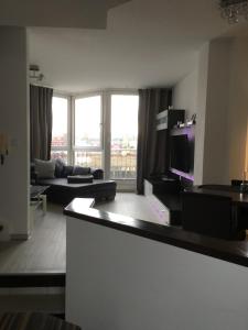 a living room with a couch and a tv at City Marina 78 in Cuxhaven