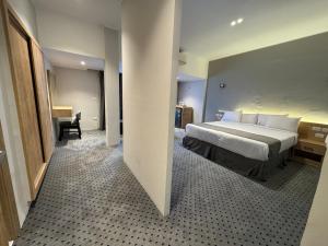 Postel nebo postele na pokoji v ubytování Atlas International Hotels