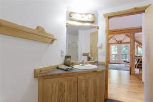 a bathroom with a sink and a mirror at Bear Hideaway in Packwood +76 photos