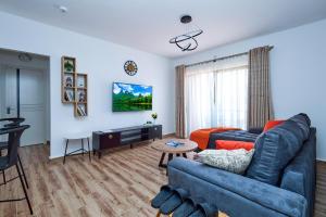 TV a/nebo společenská místnost v ubytování Orana homes