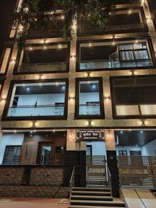 a building with stairs in front of it at night at Luxurious 2 BHK Apartment - Home away from Home ! in Udaipur