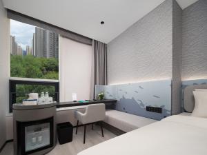Postel nebo postele na pokoji v ubytování Atour Light Hotel Xi'an Jingkai North Railyway Station