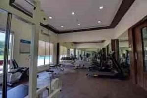 a large room with a gym with people in it at Ivy Bliss Studio with Common Pool, B 14, Karjat in Karjat