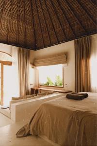 Postel nebo postele na pokoji v ubytování CASA ULU Boutique Hotel and Retreat, Adult-only, Uluwatu