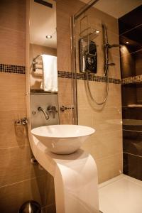 a bathroom with a sink and a shower at Trivelles Park Hotel in Preston