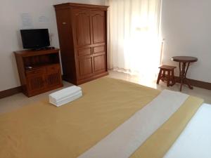 TV a/nebo společenská místnost v ubytování Phumchan Place Hotel