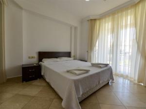Postel nebo postele na pokoji v ubytování SUNSET BEACH CLUB LEBRENTALS