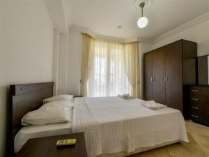 Postel nebo postele na pokoji v ubytování SUNSET BEACH CLUB LEBRENTALS