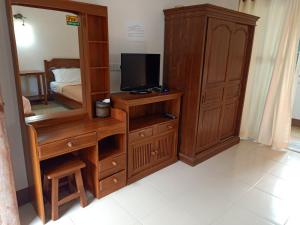 TV a/nebo společenská místnost v ubytování Phumchan Place Hotel