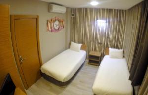 Postel nebo postele na pokoji v ubytování Okur Otel