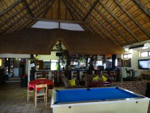 a pool table in the middle of a restaurant at Abba Game Lodge in Modimolle