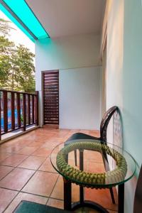 a snake wrapped around a chair on a balcony at 17 Happiness in Xiaoliuqiu