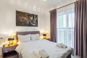 Postel nebo postele na pokoji v ubytování Luxury Collection Flats in Centre of #Beautiful #Brasov at #Coresi Mall