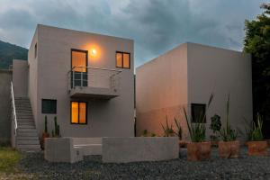 a white house with the lights on at Casa Tonalli in Jocotepec