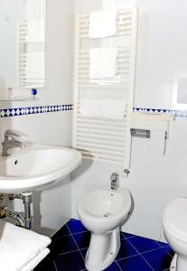 Koupelna v ubytování Hotel Anfora