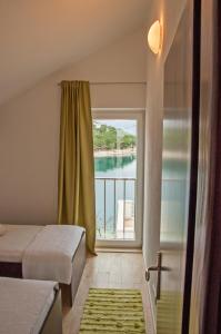 Postel nebo postele na pokoji v ubytování Holiday Home Puteus