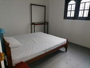 Ένα ή περισσότερα κρεβάτια σε δωμάτιο στο Bliss House