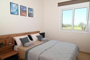 Ένα ή περισσότερα κρεβάτια σε δωμάτιο στο Myrteni guesthouse