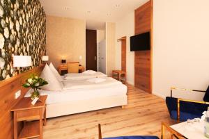 Postel nebo postele na pokoji v ubytování Hotel Gersfelder Hof