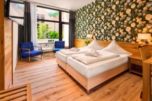Postel nebo postele na pokoji v ubytování Hotel Gersfelder Hof