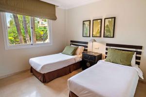 Wyndham Grand Costa del Sol客房内的一张或多张床位