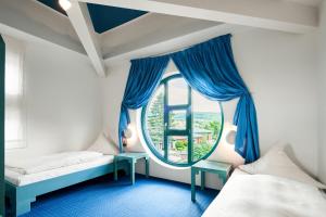 Postel nebo postele na pokoji v ubytování Hotel Gersfelder Hof + 29 fotografií