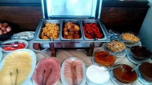 a table with many different types of food on it at Tokalis Boutique Hotel & Spa in Nea Anchialos